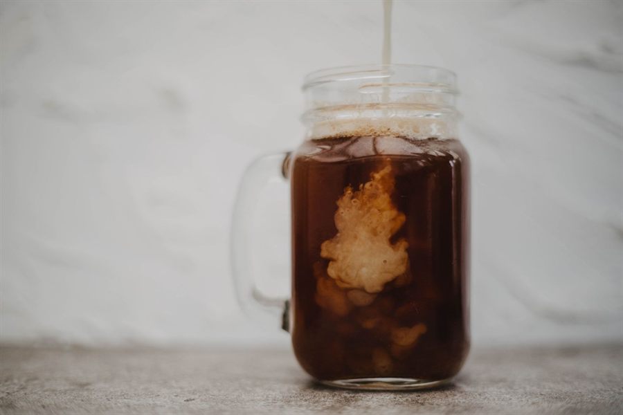 Cream swirling into cold brew