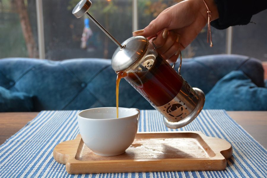Pouring coffee from a French press